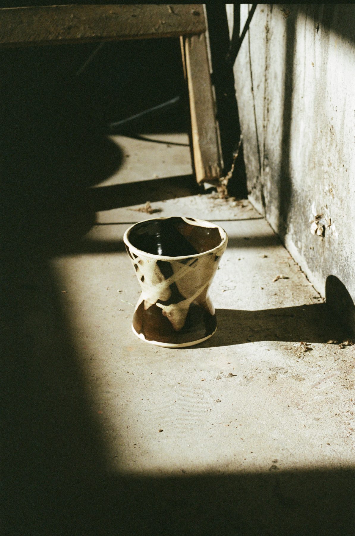 Sculptural glazed vase in the studio light